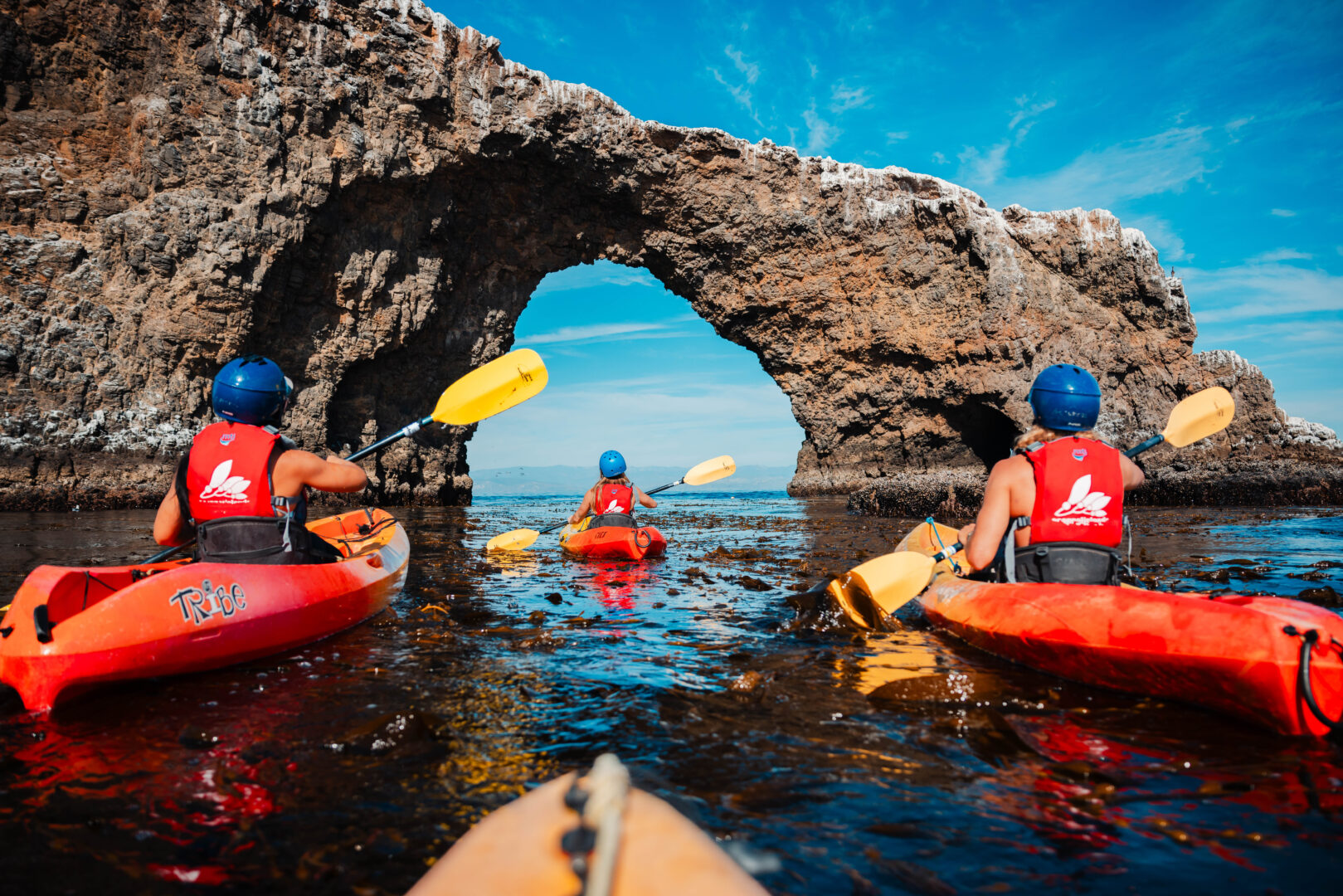 Kayakers exploring Channel Islands National Park makes visiting Ventura County Coast an authentic coastal escape.